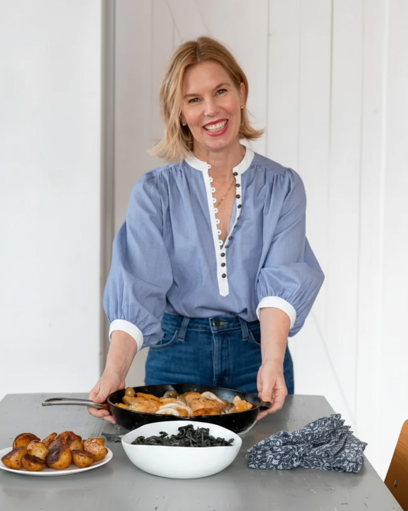Katie Sullivan Morford in a blue shirt preparing food in a kitchen